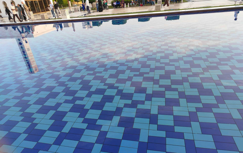 Clear transparent swimming pool with blue tiles